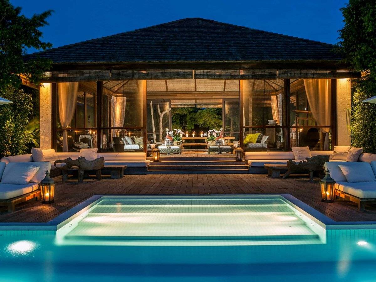 Paradise Photography via Christie's International Real Estate a-screened-in-guest-pavilion-is-the-centerpiece-of-karans-property