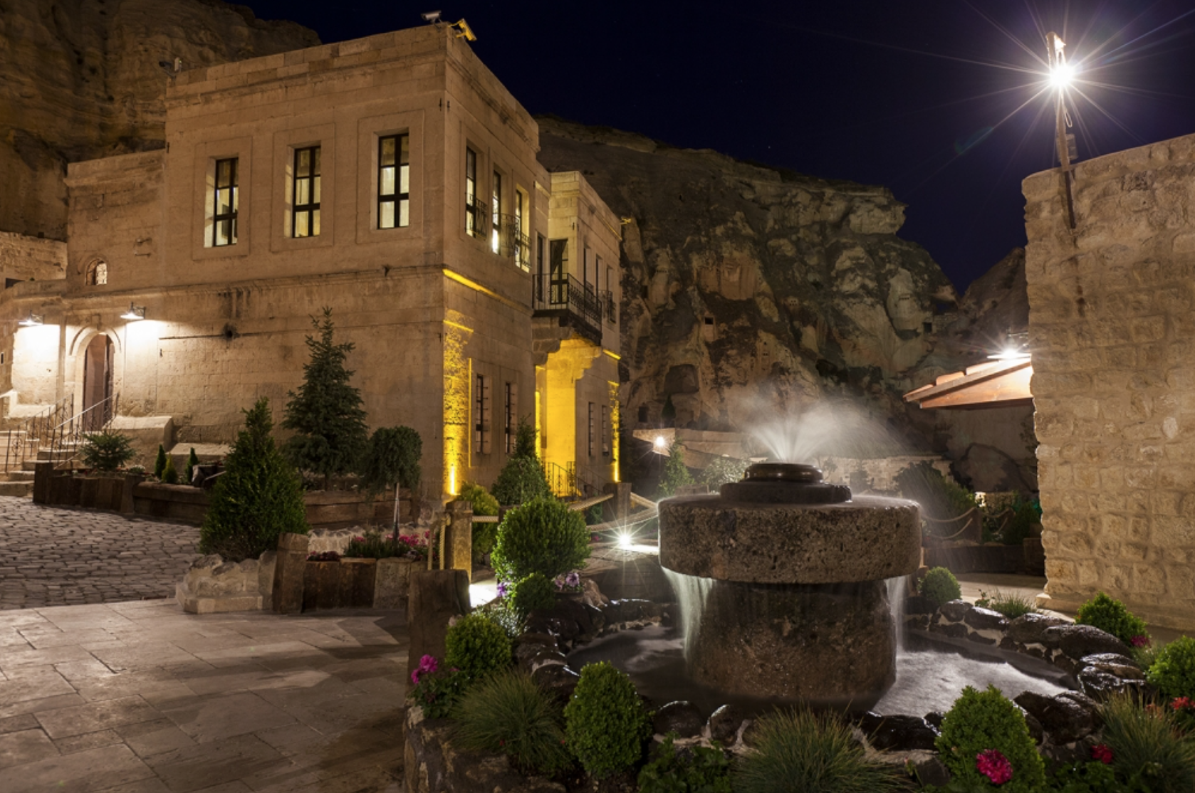 The Yunak Evleri hotel includes the caves and an adjacent 19th century Greek mansion.