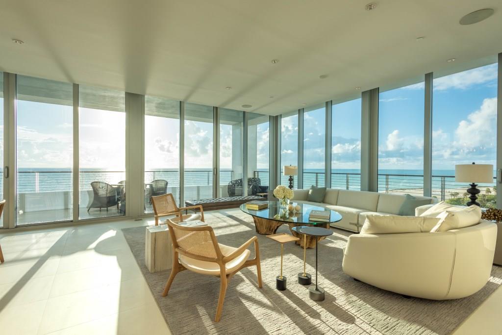 living area with balcony and ocean view